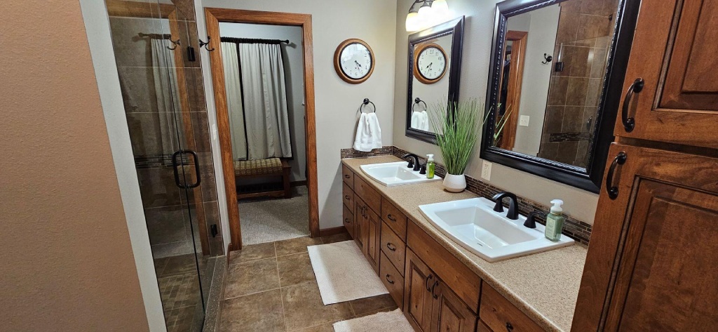 Contact Modern Primary Bathroom with Double Vanity Walk In Shower and Custom Cabinetry.jpg