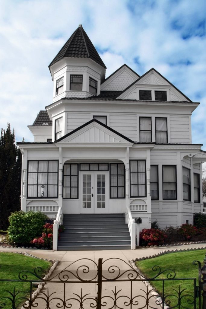 New Home Classic Victorian Architecture with Turret and Wraparound Porch.jpg