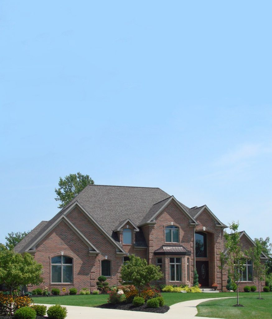 Sellers Advantage Stately Two Story Red Brick Executive Estate with Arched Windows.jpg