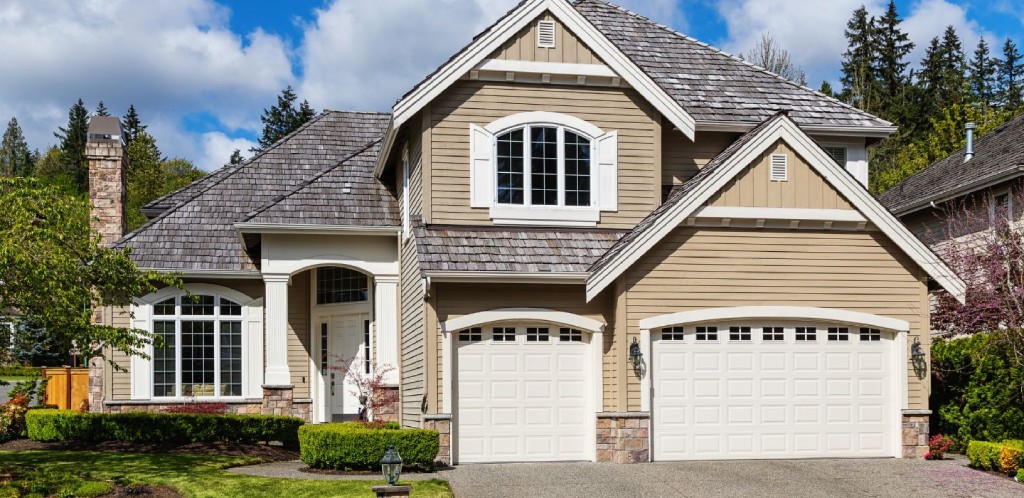 Shane house modern craftsman home exterior with white double garage.jpg