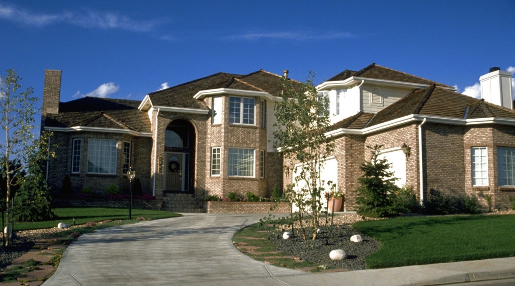 shane executive suburban home with stone accents and pillars.jpg